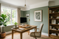 AI-generated home office inspiration with sage green matt walls and oak desk