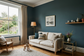 AI-generated living room inspiration with deep teal walls